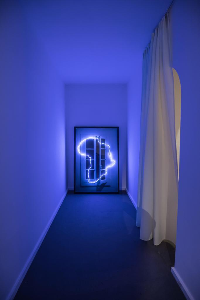 View of the artwork by Mohamed El Baz, Love Suprême, 2007 Bricoler l’Incurable series Color photography, neons, wood and mural painting 180 x 120 cm © Mohamed El baz. Africa is no Island exhibition at the MACAAL