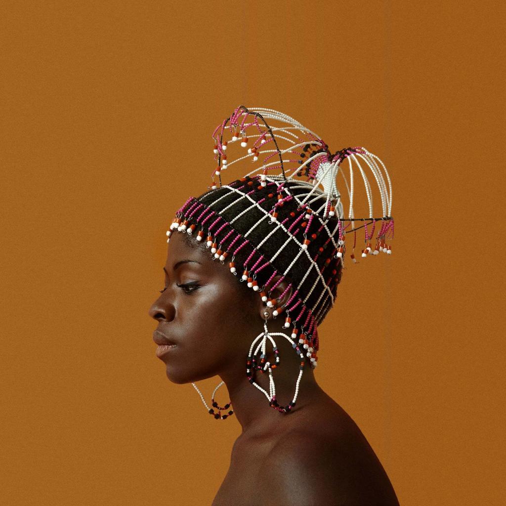 Sikolo Brathwaite in 1968 wears a headpiece designed by Carolee Prince. Photograph: Courtesy of the artist and Philip Martin Gallery. Cover of the Art Book , Black is Beautiful by Kwame Brathwaite